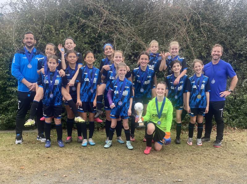 Delmarva Rush girls’ U12 team members shown are coach Sean Endicott, Sophia Santini, Aurelia Berrocal, Eva Piper, Isabella Iarussi, Sophia Zhou, Tejal Pillai, Layla Minnick, Cataleya Abel, Garrity Cox, Emily Hilton, Charlotte Gillman, Adelyn Thurman, Maddie Hill, Sadie Strumpf and assistant coach Ritchie Thurman. SUBMITTED PHOTOS